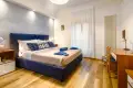 Bright blue bedroom ideal for a stay in Siena